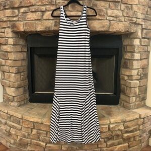 Eunishop black and white striped maxi dress with flared bottom.  Medium